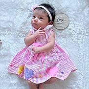 Celeste joined the competition — help win amazing prizes! baby, infant, pink_dress, headband, flower, heart_patch, blanket, wooden_plaque, one_month, cute, child, newborn, portrait, lying_down, soft_texture, milestone, small_hands, small_feet, white_background, adorable