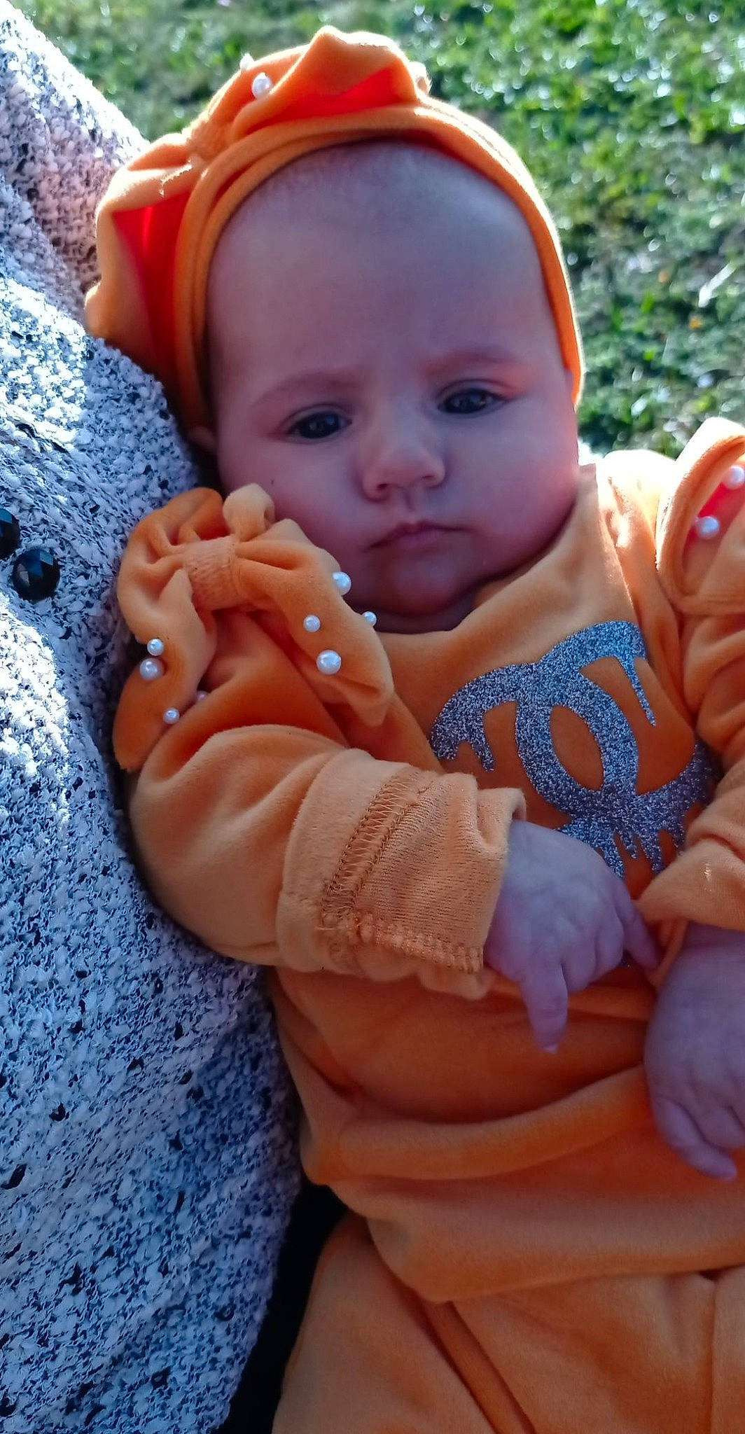 Liyah participe au concours pour gagner de l'argent avec cette photo : baby, baby_products, baby_toddler_clothing, cheek, child, chin, eye, face, finger, gesture, grass, hand, happy, head, lip, nail, person, pink, skin, thumb