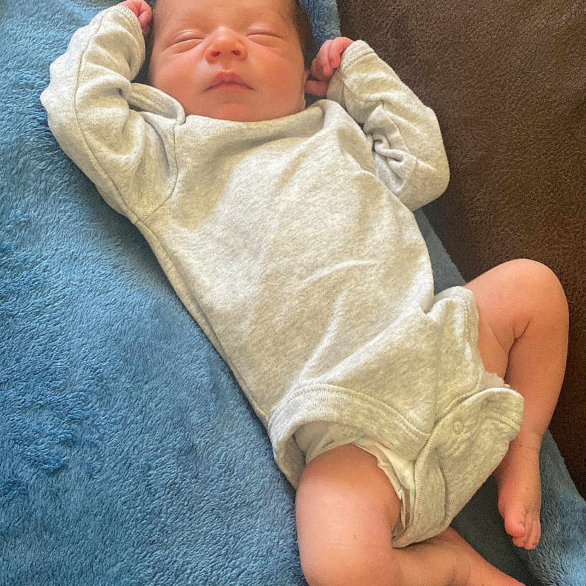 Enzo joined the competition — help win amazing prizes! baby, bed, blanket, bodypart, clothing, couch, cushion, face, finger, furniture, glove, hand, head, homedecor, newborn, person, photography, portrait, quilt, sleeping