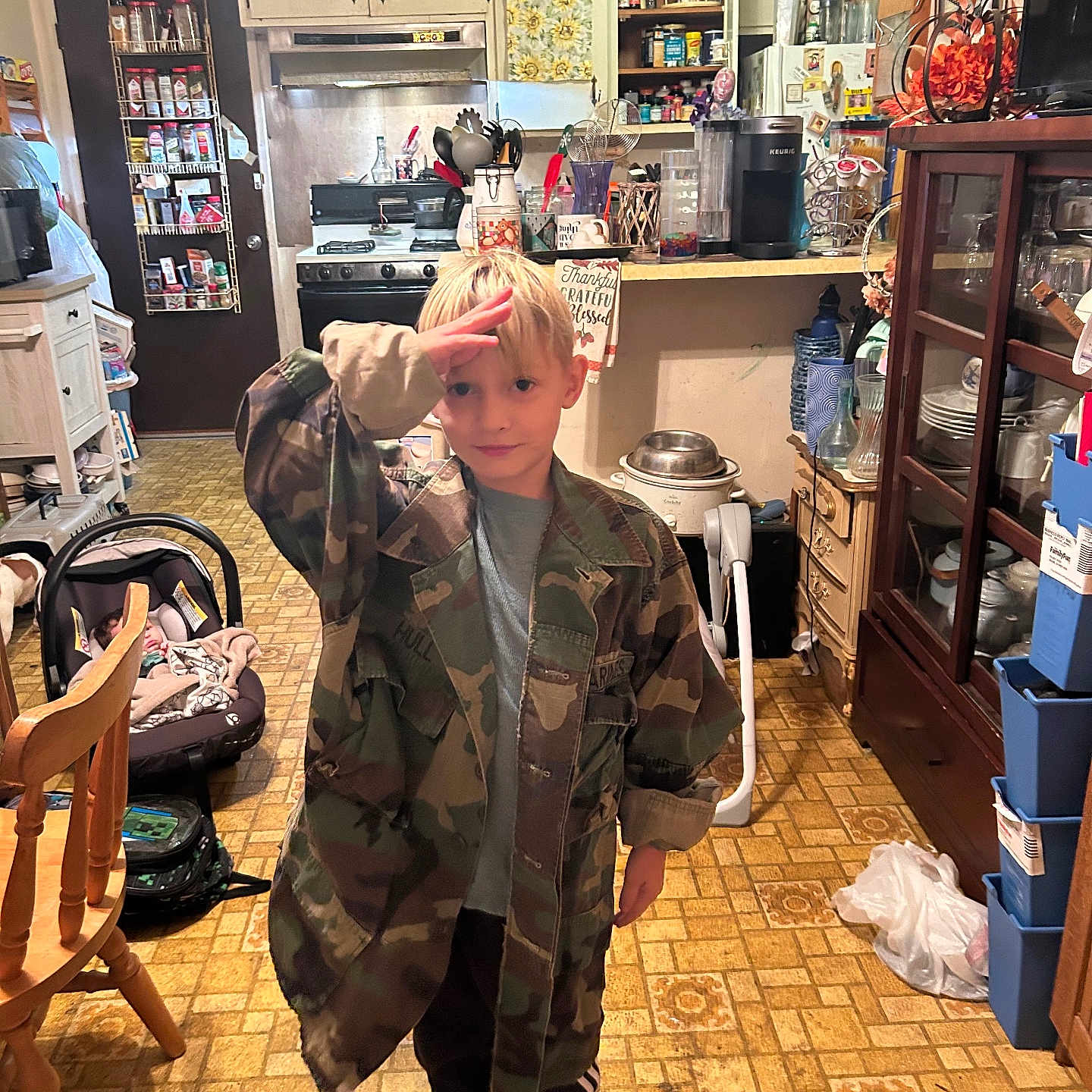 Hayden is registered to the contest to win money with this photo: accessories, bag, barbershop, boy, chair, child, clothing, coat, computerhardware, face, footwear, furniture, handbag, head, indoors, male, person, photography, portrait, shoe