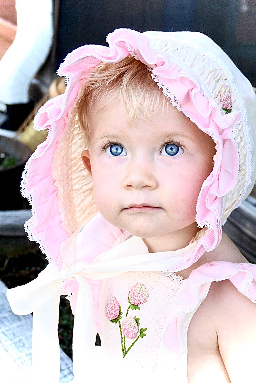 Anna is registered to the contest to win money with this photo: baby, baby_toddler_clothing, cap, cheek, chin, eye, eyebrow, eyelash, face, happy, headgear, headwear, iris, lip, outerwear, person, pink, skin, sleeve, textile