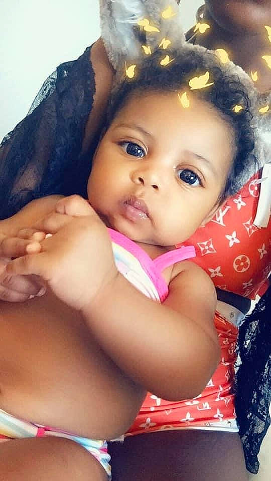 Blessing is registered to the contest to win money with this photo: abdomen, baby, beauty, black_hair, cheek, child, eye, face, forehead, fun, head, lip, mouth, nose, person, photography, pink, skin, smile, toddler