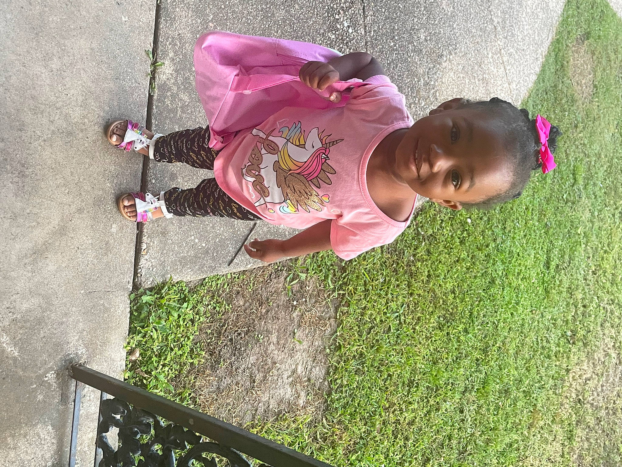 Kahlilia is registered to the contest to win money with this photo: adaptation, baby, baby_toddler_clothing, child, concrete, fun, grass, happy, hat, joy, leisure, magenta, mammal, organism, people_in_nature, person, pink, plant, recreation, toddler