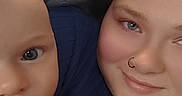 Matteo joined the competition — help win amazing prizes! baby, child, woman, face, smile, portrait, indoor, blanket, blue_clothing, necklace, skin, head, person, young, candid, closeup, comfort, family, cute, toddler