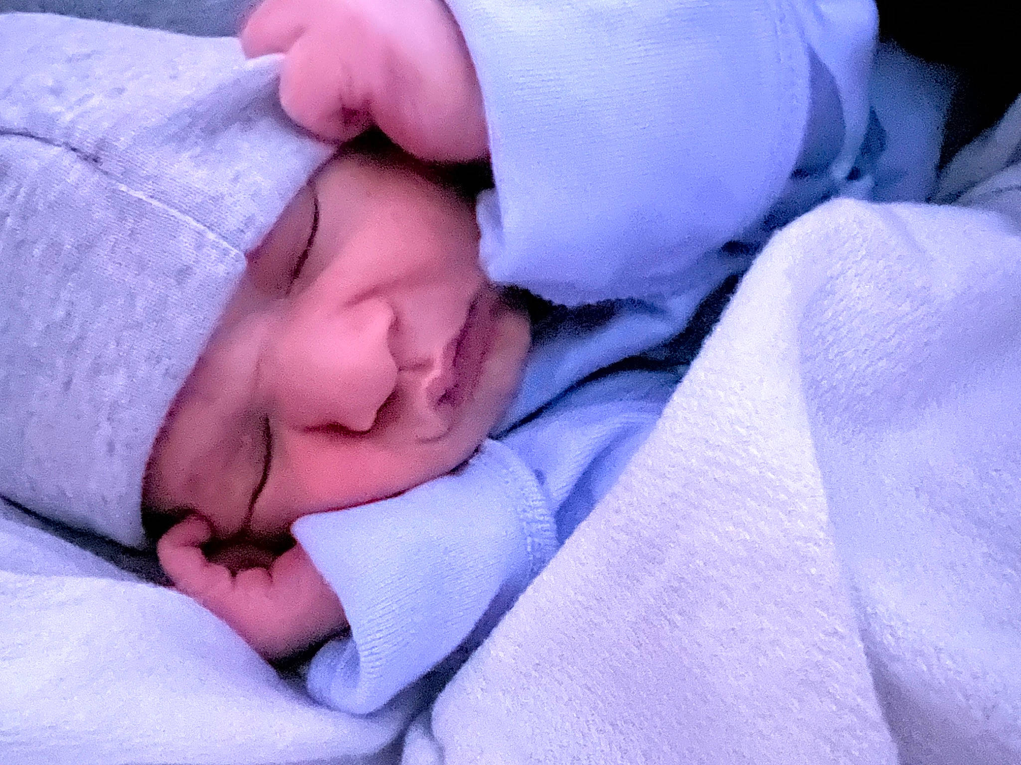 Cassius is registered to the contest to win money with this photo: baby, bedtime, cheek, child, childbirth, comfort, electric_blue, eye, gesture, hand, headwear, linens, nail, nap, pattern, person, purple, room, sleep, textile