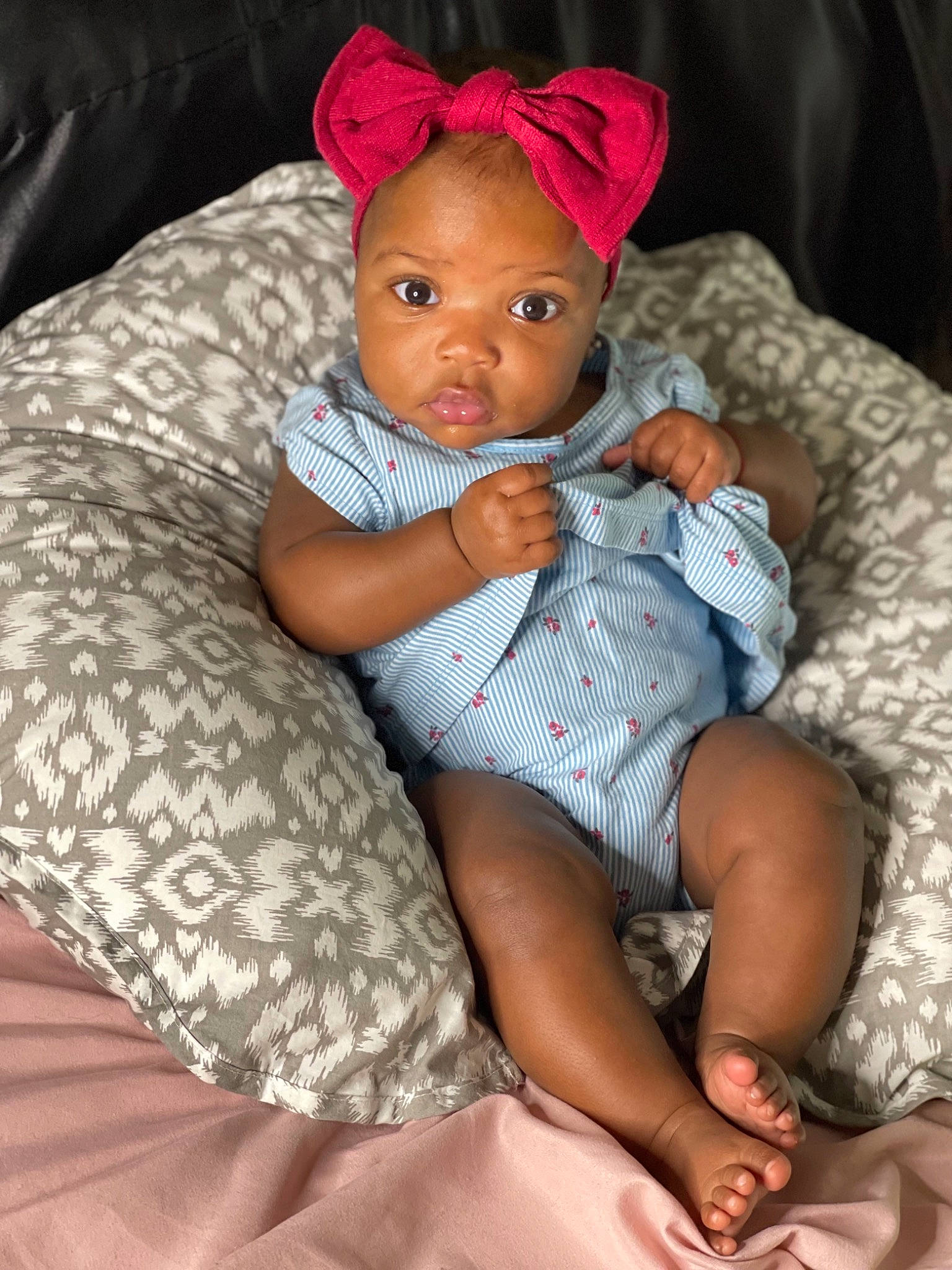 Nymira is registered to the contest to win money with this photo: baby, baby_toddler_clothing, cap, child, comfort, doll, eye, face, hairstyle, hand, head, human_body, lap, leg, linens, mouth, person, pink, skin, thigh