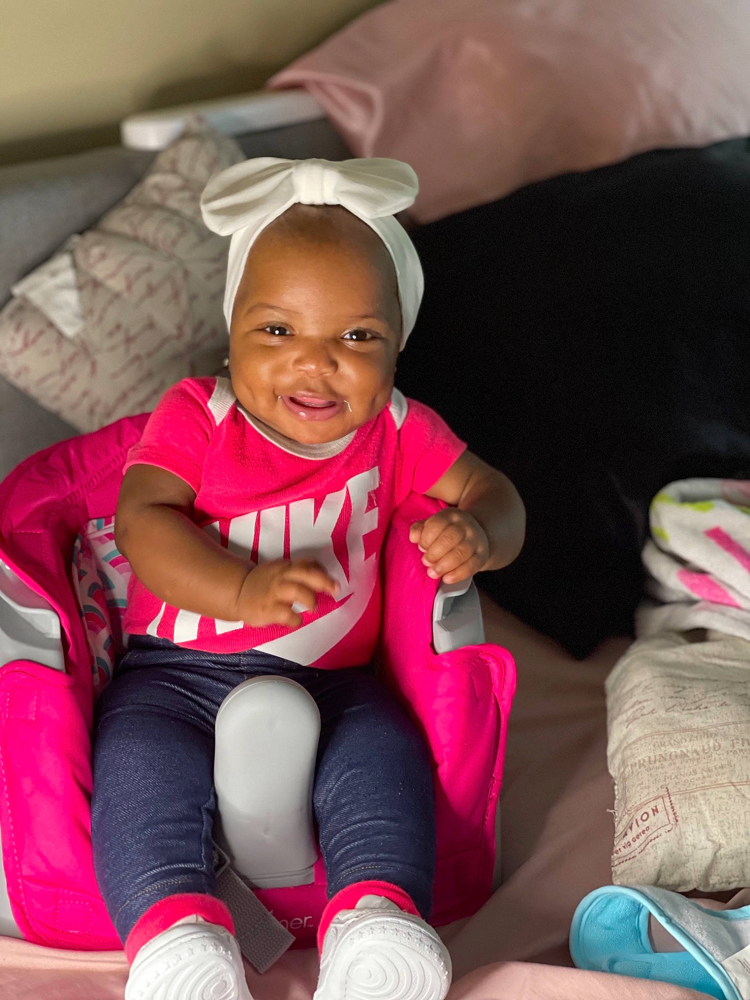 Nymira is registered to the contest to win money with this photo: baby, baby_toddler_clothing, beauty, car_seat, child, comfort, fun, happy, knee, lap, leg, leisure, magenta, mouth, person, pink, skin, smile, sock, thigh