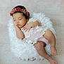 baby, sleeping, floral_crown, lace, white_cushion, pastel_background, peaceful, infant, cute, soft_texture, portrait, child, adorable, resting, newborn, peace, soft_lighting, delicate, cozy, calm