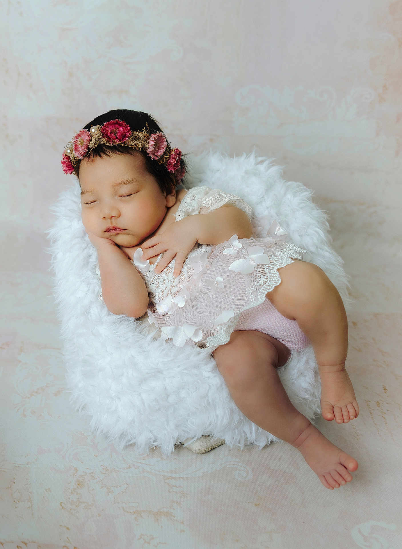 Meghan joined the competition — help win amazing prizes! baby, sleeping, floral_crown, lace, white_cushion, pastel_background, peaceful, infant, cute, soft_texture, portrait, child, adorable, resting, newborn, peace, soft_lighting, delicate, cozy, calm