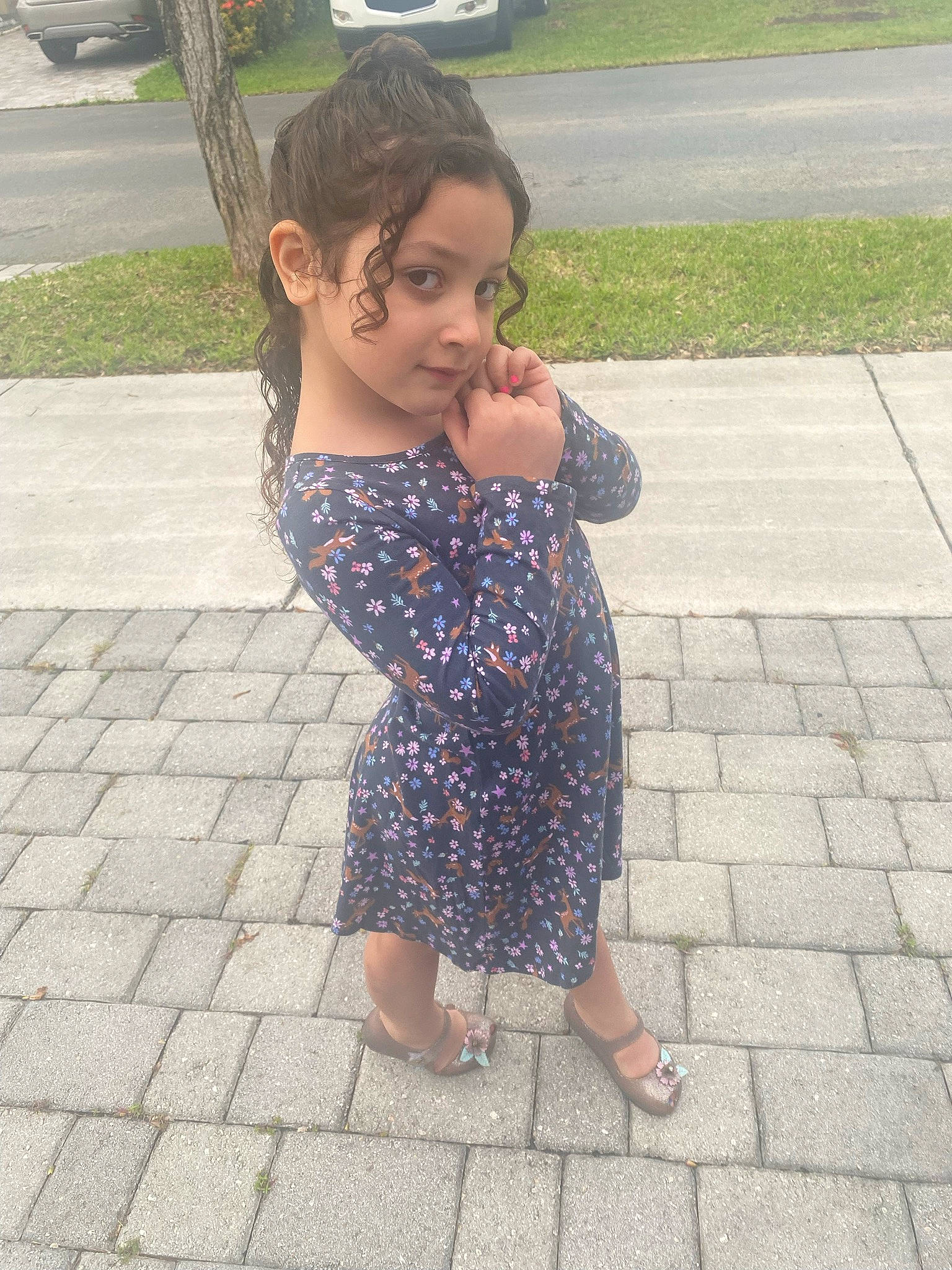 Isabella Lorraine is registered to the contest to win money with this photo: arm, asphalt, dress, finger, flooring, gesture, grass, hand, happy, head, human_body, leisure, person, plant, public_space, road_surface, shoulder, sidewalk, thigh, tree