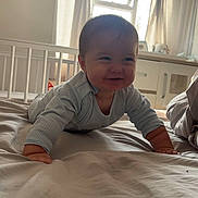 Freddie joined the competition — help win amazing prizes! baby, child, crawling, bed, pajamas, smiling, indoor, window, curtains, nursery, crib, furniture, soft_light, happy, person, portrait, infant, baby_girl, baby_boy, cozy