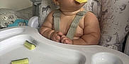 Freddie joined the competition — help win amazing prizes! animal_print, baby, child, chubby_cheeks, cucumber, curious, cute, feeding, food, high_chair, indoor, infant, kitchen, messy, pineapple, portrait, sitting, snack, straps, tray