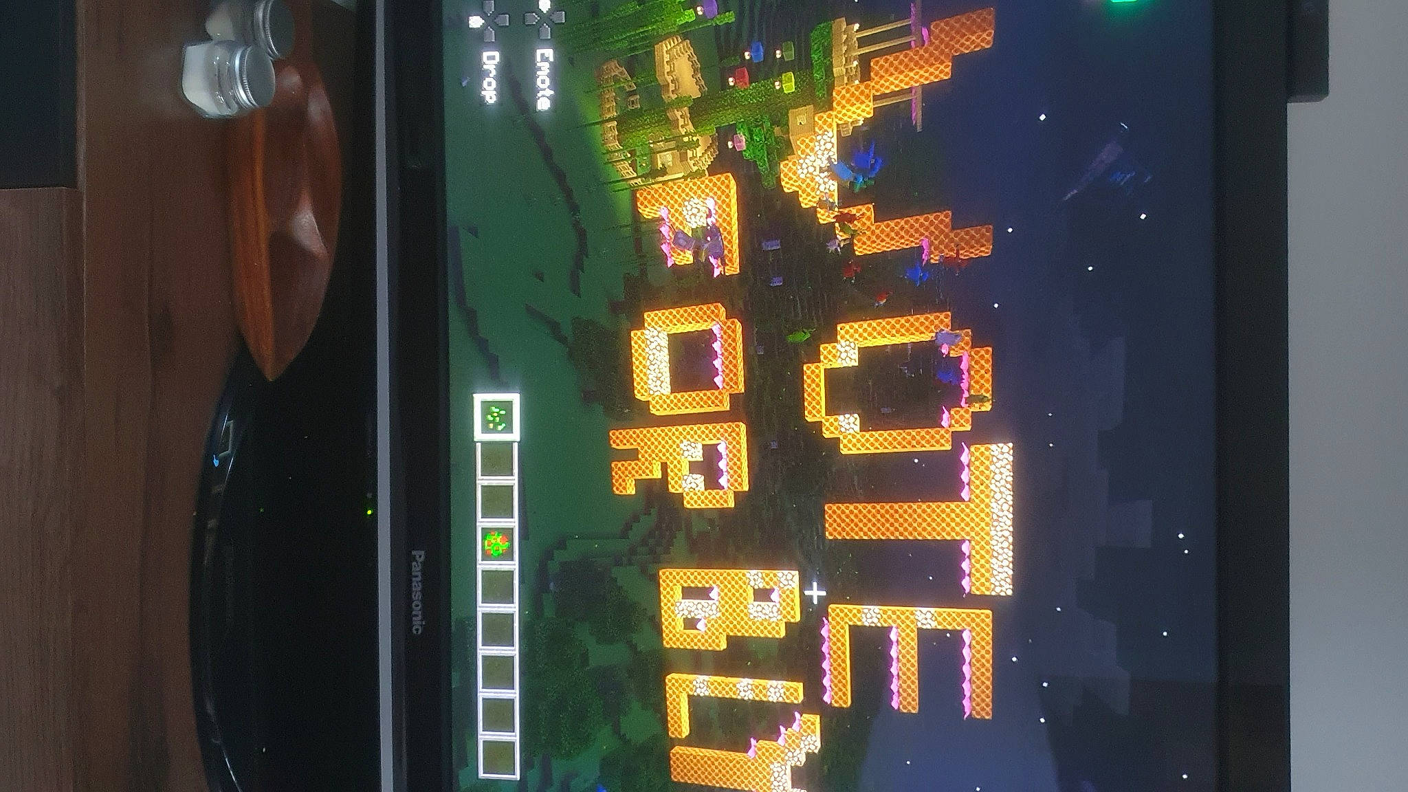 Bly is registered to the contest to win money with this photo: building, city, display_device, electric_blue, electrical_supply, electricity, electronic_device, electronic_signage, event, font, machine, metropolis, pattern, rectangle, signage, space, technology, tree, urban_design, window