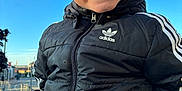 Sean is registered to the contest to win money with this photo: adidas, blue_sky, boy, casual_wear, child, closeup, daylight, fashion, glasses, happy, jacket, outdoor, person, playful, portrait, smile, street, urban, warm_clothing, young