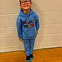 Sean joined the competition — help win amazing prizes! blue_hoodie, blue_pants, boy, casual_clothing, child, cute, eyewear, fashion, floor, glasses, happy, indoor, person, playful, portrait, smile, socks, standing, wall, young