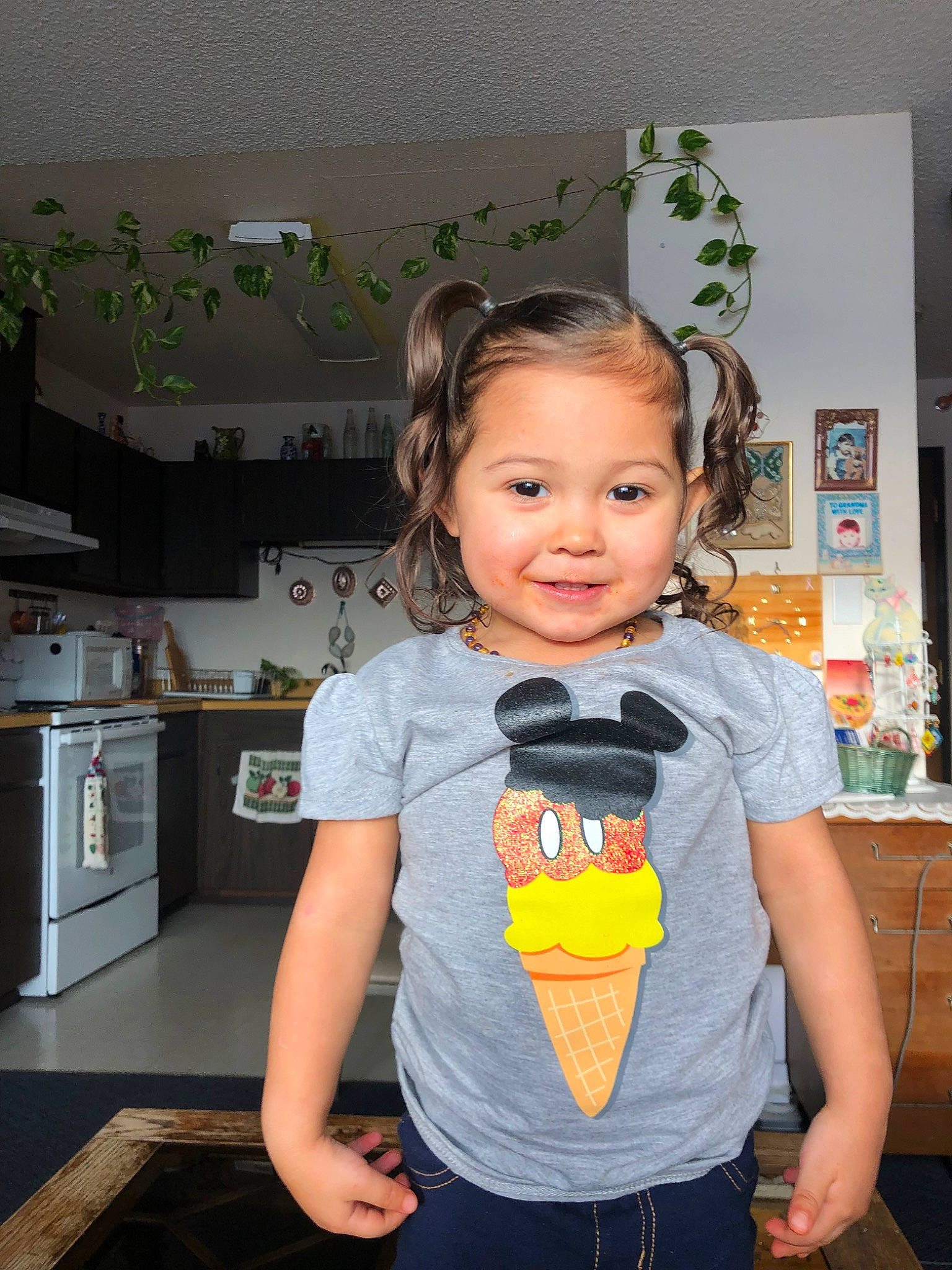 Irelynn is registered to the contest to win money with this photo: child, electronic_device, joy, person, room, shoulder, standing, t_shirt, toddler