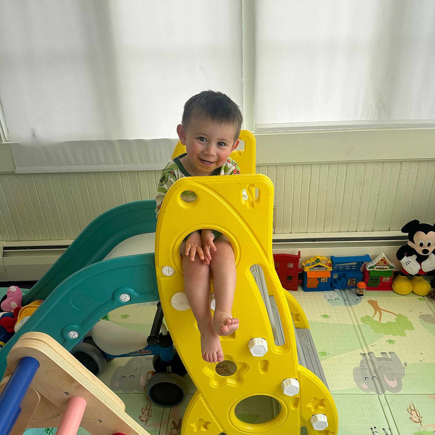 Ryder is registered to the contest to win money with this photo: baby, beverage, coffee, coffeecup, cutlery, face, fork, head, indoorplayarea, indoors, interiordesign, outdoorplayarea, outdoors, person, photography, playarea, portrait, sitting, slide, toy