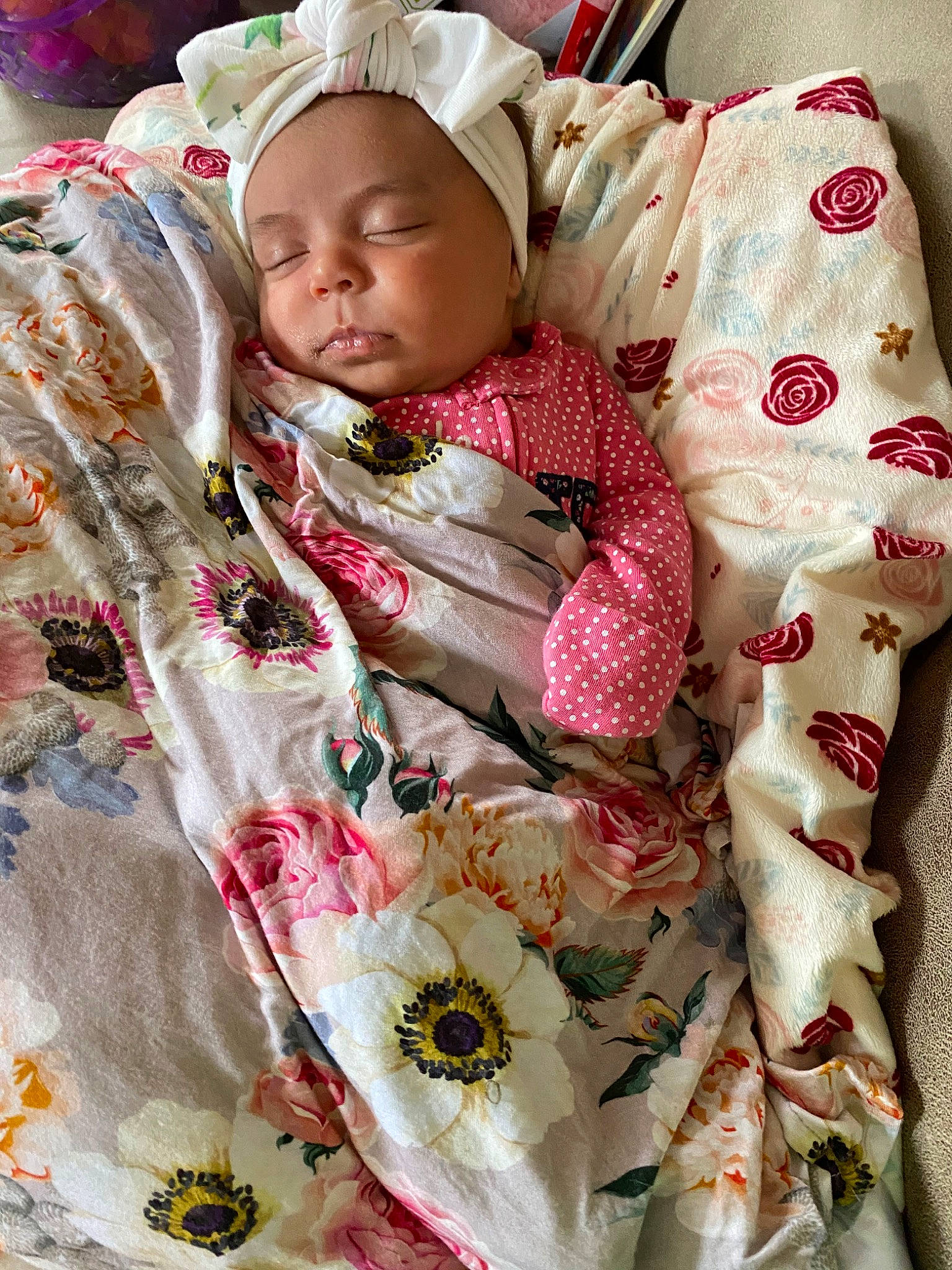 Aniyah is registered to the contest to win money with this photo: baby, child, headwear, linens, person, pink, plant, smile, textile, toddler