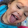 child, close_up, tongue, happy, messy, face, smile, bib, food, playful, person, young, expression, fun, outdoor, colorful, skin, hair, mouth, teeth
