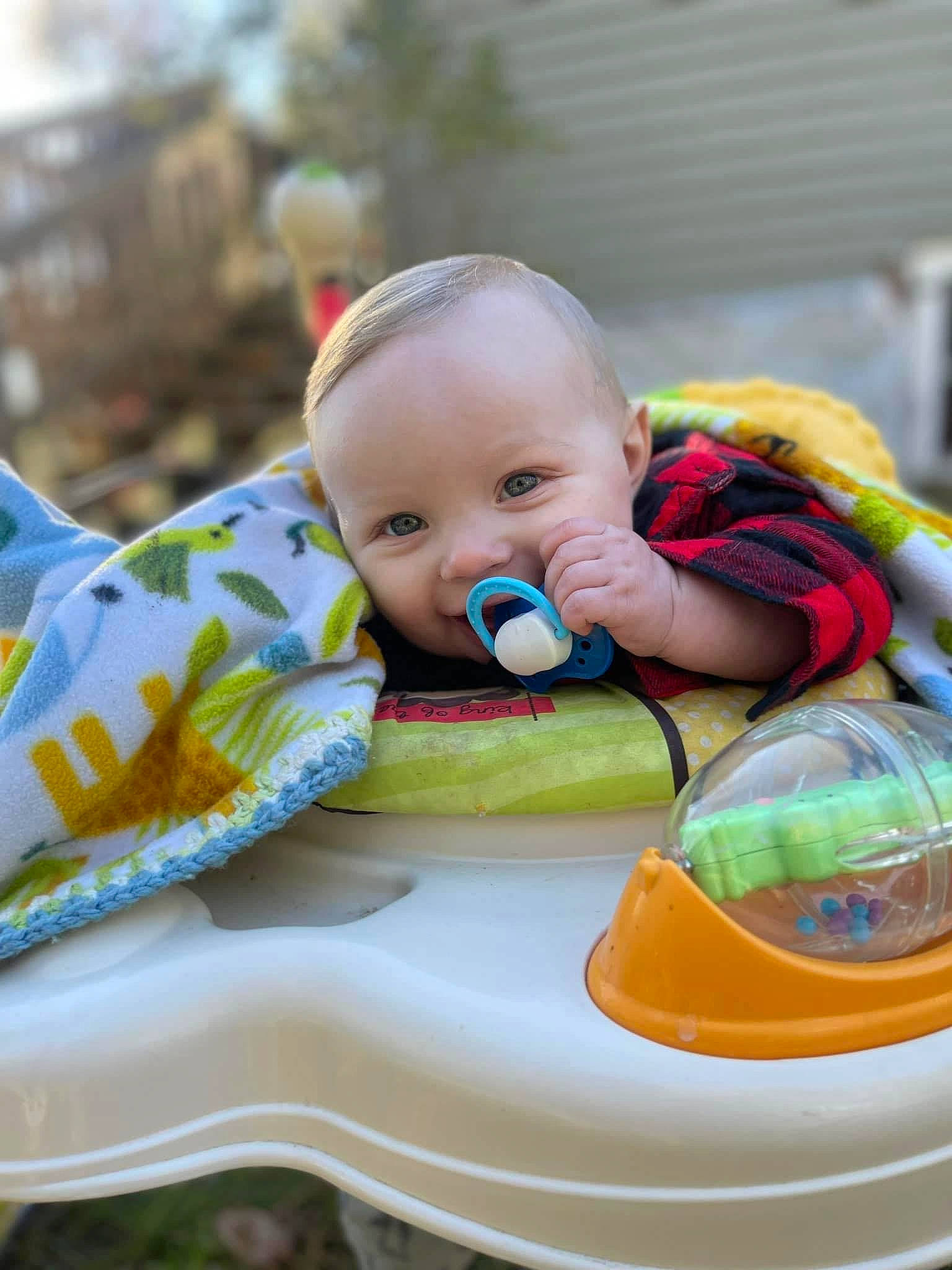 Bryson is registered to the contest to win money with this photo: baby, baby_products, baby_toddler_clothing, bib, cheek, child, comfort, fun, grass, happy, linens, person, personal_protective_equipment, portrait_photography, sitting, toddler