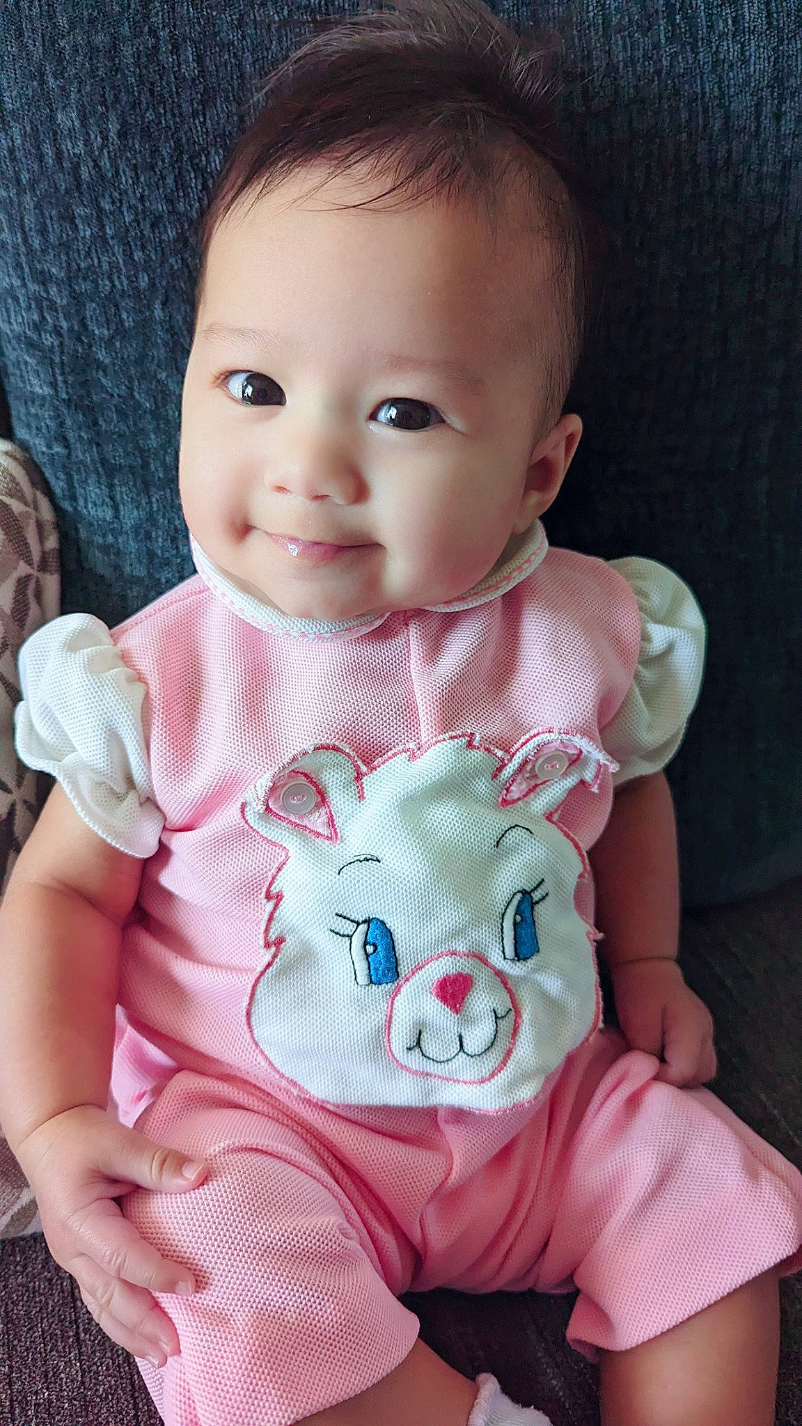 Anastasia is registered to the contest to win money with this photo: baby, baby_toddler_clothing, cheek, chin, dress, eye, eyelash, face, head, human_body, iris, lip, mouth, neck, nose, outerwear, person, skin, sleeve, smile