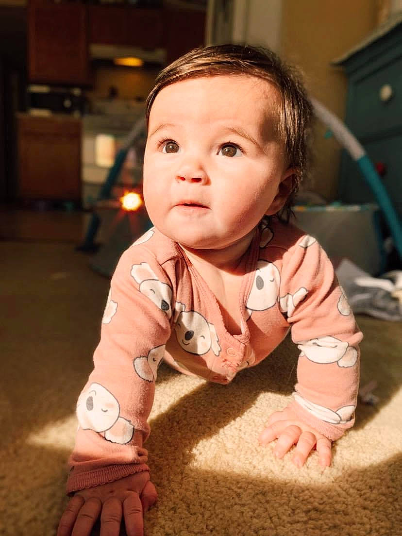 Raelynn is registered to the contest to win money with this photo: baby, beauty, cheek, child, chin, eye, face, floor, flooring, head, person, photography, play, skin, smile, toddler