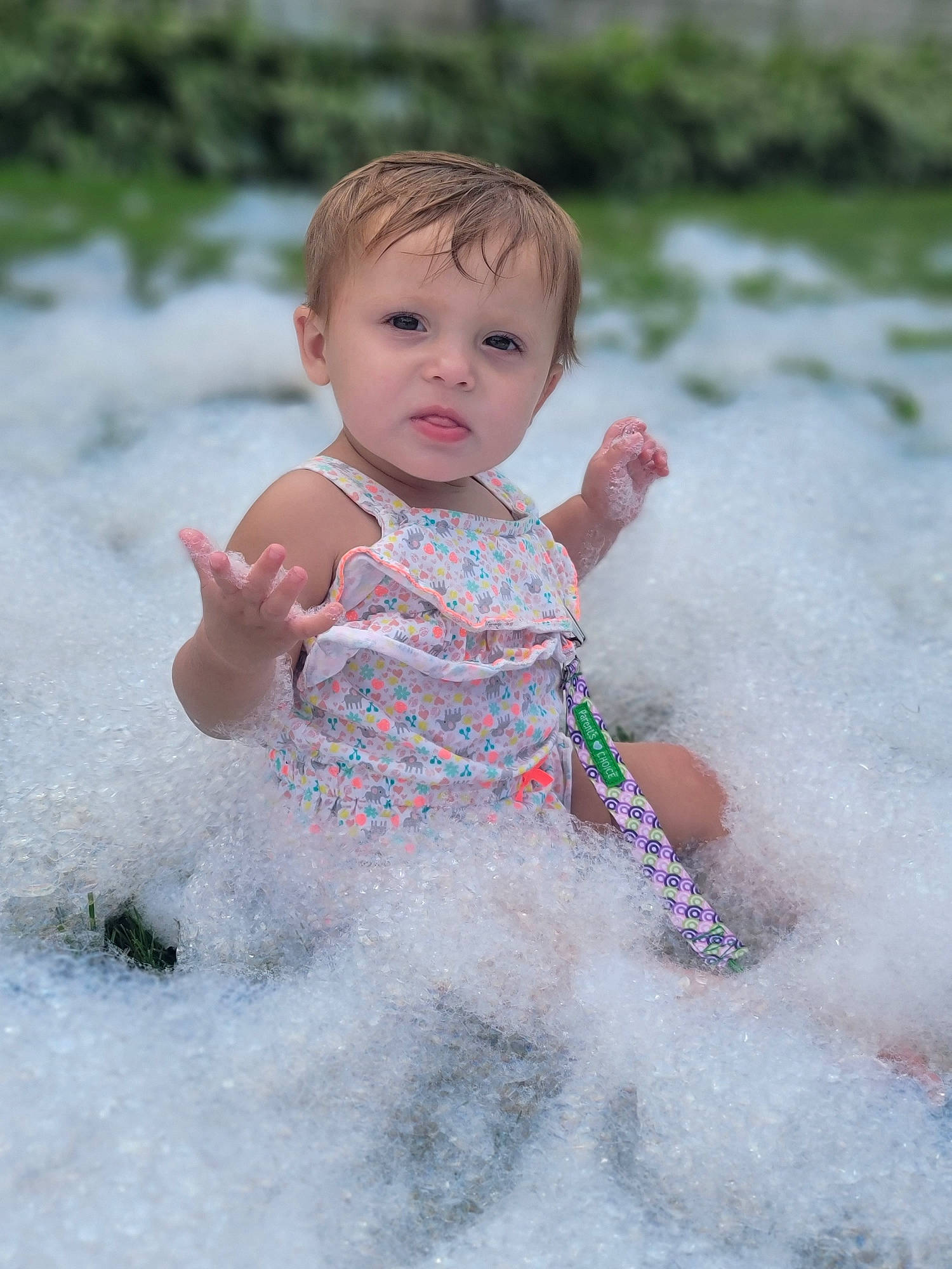 Scotlyn is registered to the contest to win money with this photo: baby, baby_toddler_clothing, beauty, cheek, dress, eye, face, finger, fun, grass, hair, hand, happy, human_body, people_in_nature, person, pink, skin, sleeve, summer