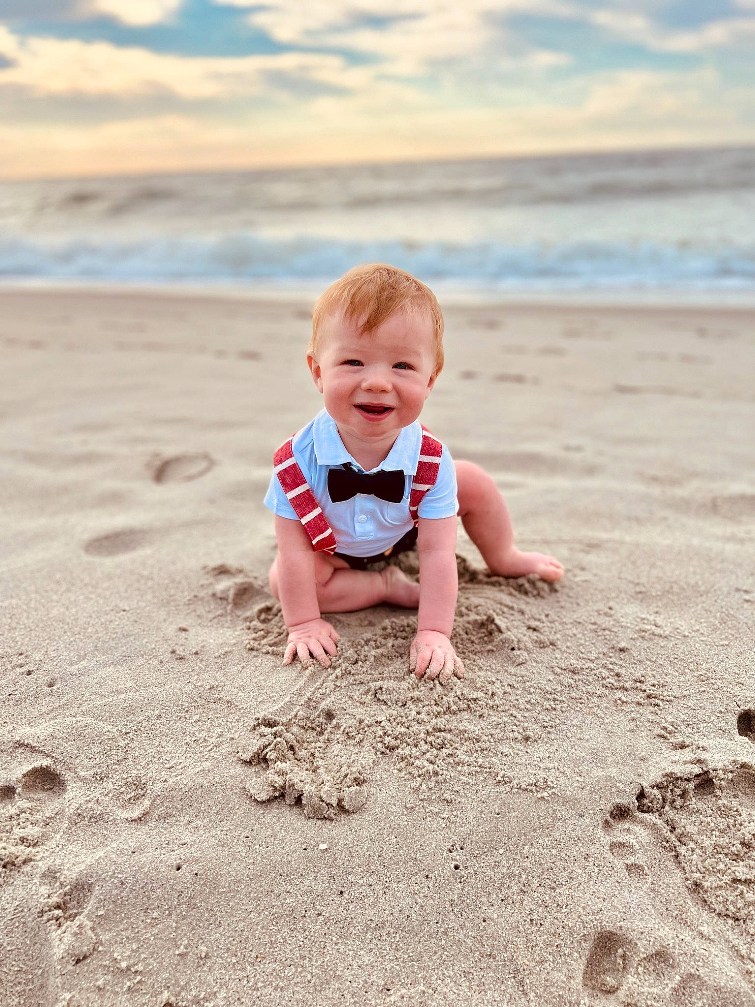 Lucian Holt is registered to the contest to win money with this photo: baby, beach, cloud, coastal_and_oceanic_landforms, flash_photography, fun, happy, head, horizon, human_body, joy, landscape, leg, morning, people_in_nature, people_on_beach, person, sky, smile, standing
