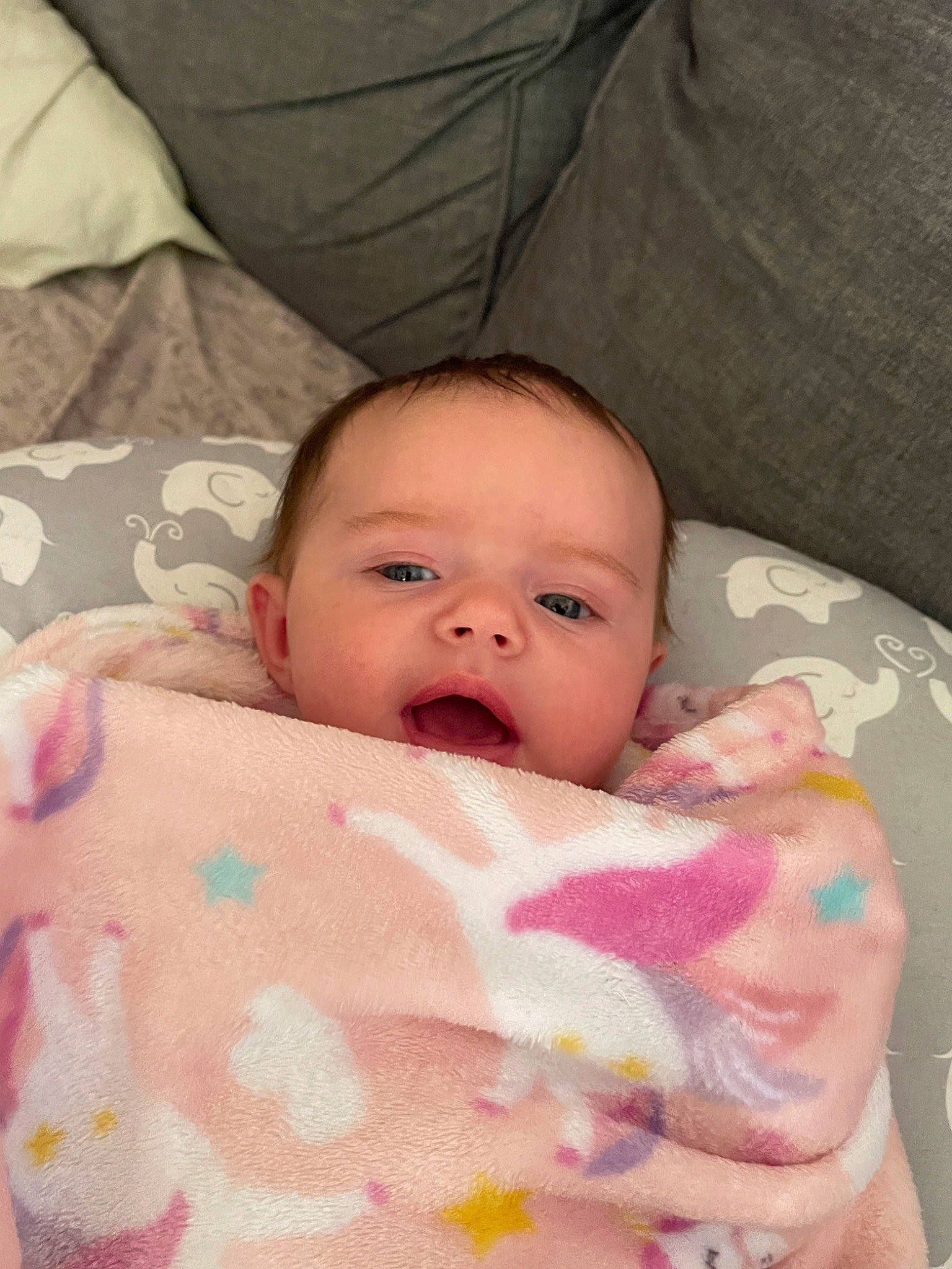 Eden is registered to the contest to win money with this photo: baby, baby_products, baby_toddler_clothing, bedtime, cheek, child, chin, comfort, eye, eyebrow, face, iris, linens, lip, nose, person, pink, room, skin, textile