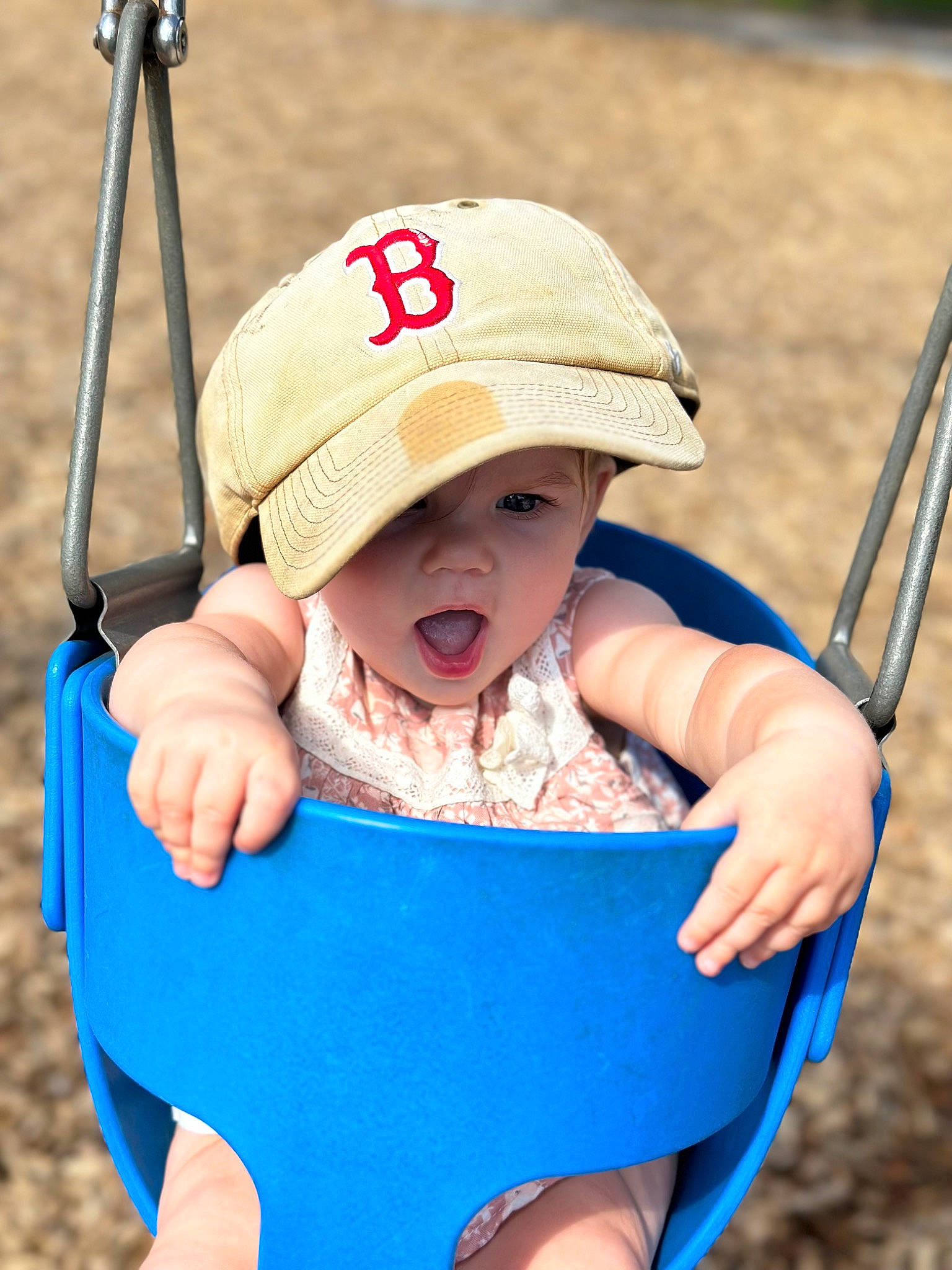 Faye is registered to the contest to win money with this photo: azure, baby, baby_toddler_clothing, blue, cap, child, electric_blue, facial_expression, fun, grass, hand, happy, headwear, leisure, people_in_nature, person, recreation, skin, sleeve, sun_hat