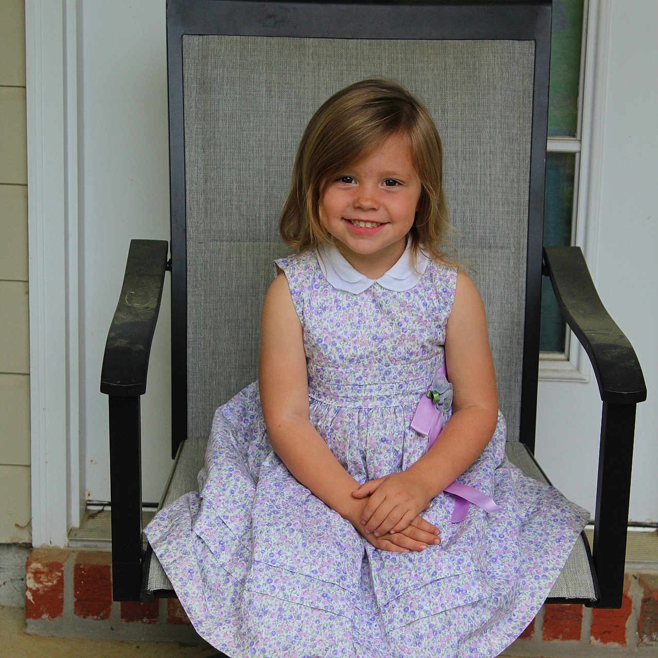 Charlotte James is registered to the contest to win money with this photo: armchair, chair, child, clothing, dress, eveningdress, face, female, footwear, formalwear, furniture, girl, head, homedecor, person, photography, portrait, rockingchair, shoe, sitting