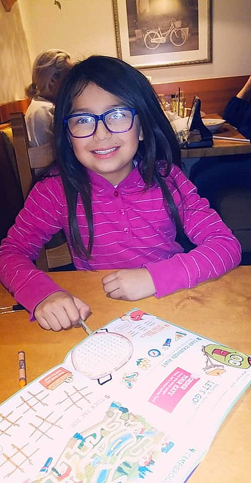 Briza is registered to the contest to win money with this photo: eyewear, glasses, homework, joy, learning, person, vision_care