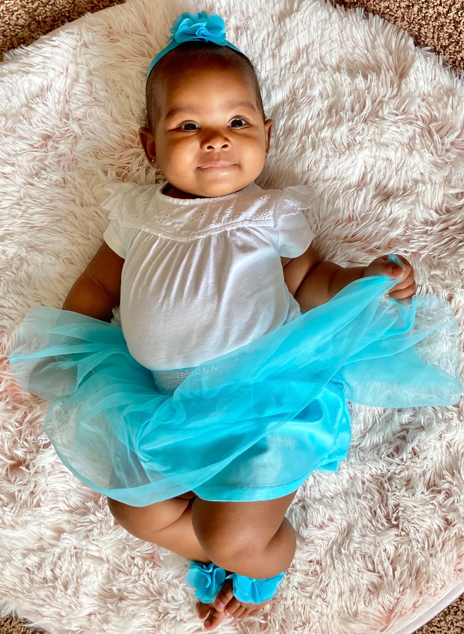 Amareea is registered to the contest to win money with this photo: aqua, arm, azure, baby, baby_toddler_clothing, blue, child, dress, eye, flash_photography, fun, grass, green, hand, happy, iris, person, pink, skin, smile