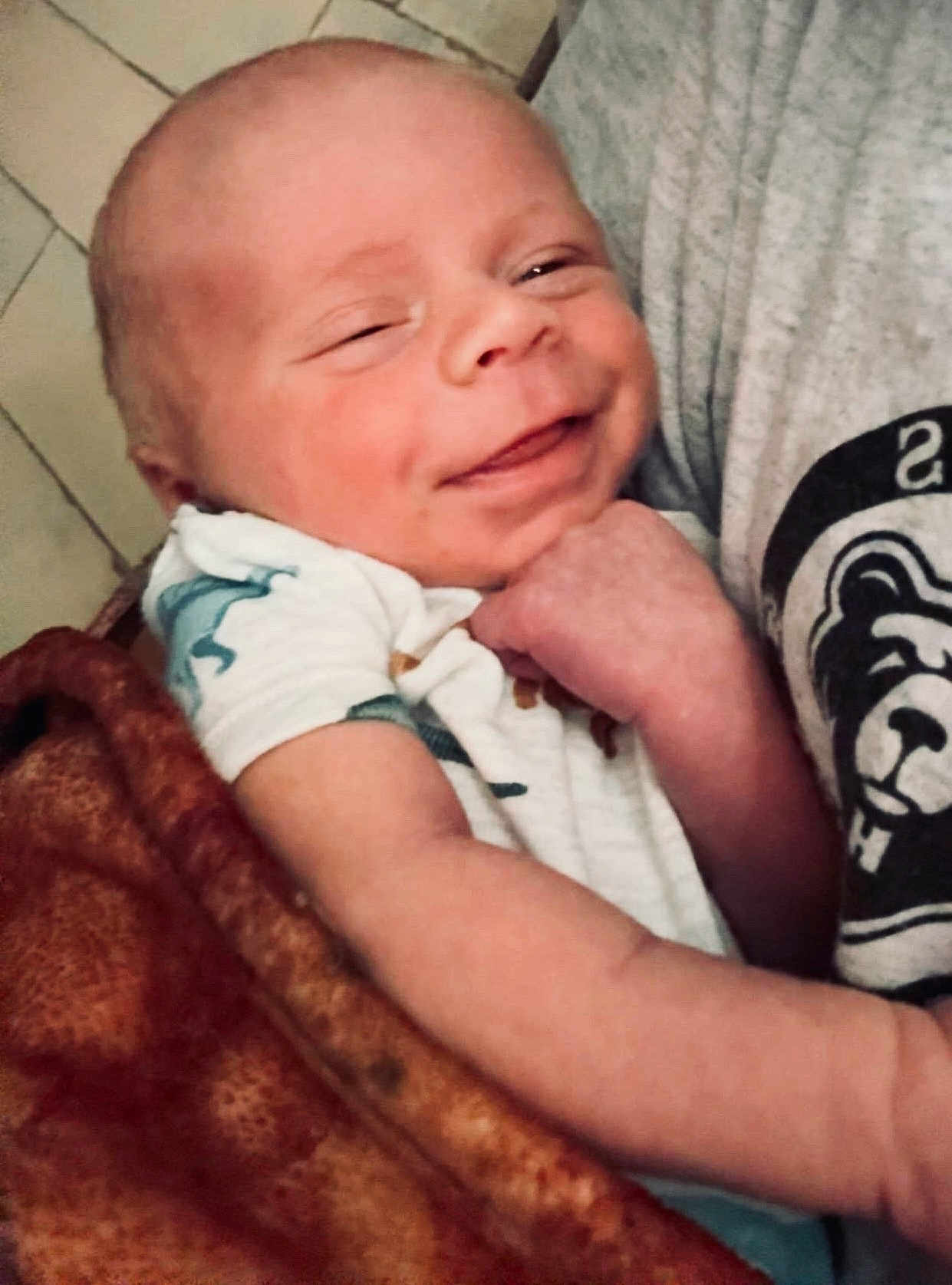 Jensen joined the competition — help win amazing prizes! baby, smiling, infant, blanket, arm, tshirt, logo, person, closeup, face, happy, skin, fabric, comfort, cuddle, indoor, young, cute, child, portrait