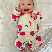 Sydney is registered to the contest to win money with this photo: baby, blanket, child, cozy, cute, face, feet, happy, indoors, infant, joy, lying_down, newborn, onesie, pink_apples, playful, portrait, small_hands, smiling, soft_texture