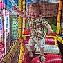 Kurtys participe au concours pour gagner de l'argent avec cette photo : toddler, child, playground, indoor, colorful, inflatable, netting, padded_steps, yellow, red, floral_shirt, shorts, sandals, happy, active, motion_blur, play_area, fun, young_child, climbing