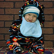 Aaliyah Ruby joined the competition — help win amazing prizes! baby, beanie, bonnet, brick, cap, clothing, coat, costume, face, glove, happy, hat, head, hood, jacket, pants, person, photography, portrait, smile
