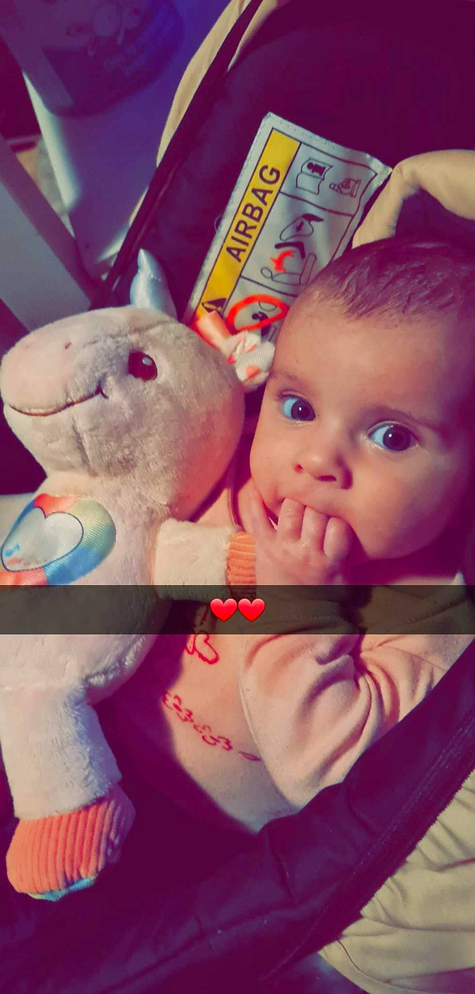 Ashley participe au concours pour gagner de l'argent avec cette photo : baby, cheek, child, ear, eyelash, facial_expression, finger, gesture, hand, happy, head, lip, magenta, mouth, nose, person, pink, skin, stuffed_toy, toddler