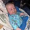 Zayden joined the competition — help win amazing prizes! baby, infant, blanket, cat, kitten, sleeping, resting, cozy, indoor, cute, animal, child, soft, blue, patterned_clothing, furry, pet, comfort, toddler, young