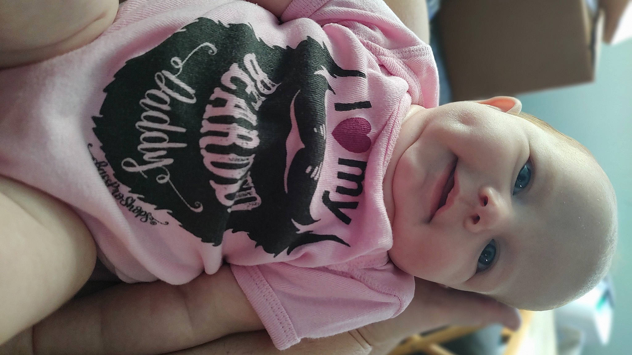 Arabella is registered to the contest to win money with this photo: arm, baby, baby_toddler_clothing, cheek, child, cool, eyelash, finger, hand, headgear, human_body, mouth, nail, neck, nose, person, pink, purple, skin, sleeve