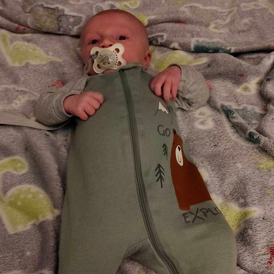 William joined the competition — help win amazing prizes! baby, bed, bedroom, blanket, bodypart, cushion, face, finger, furniture, hand, head, homedecor, indoors, newborn, person, photography, portrait, quilt, room, tape