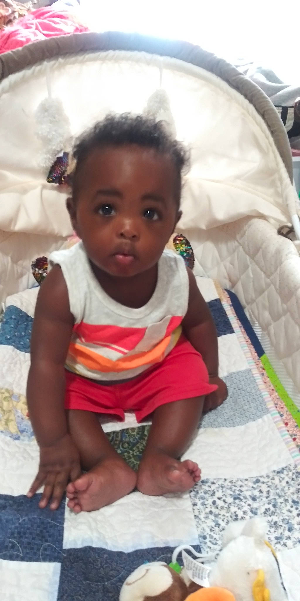 André is registered to the contest to win money with this photo: baby, black_hair, cheek, child, eye, face, head, lip, nose, person, sitting, skin, smile, toddler