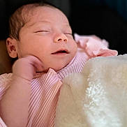 Nova is registered to the contest to win money with this photo: baby, blanket, child, closeup, cute, face, hand, indoors, infant, newborn, newborn_baby, peaceful, pink_clothing, portrait, resting, skin, sleeping, small, soft_texture, tender