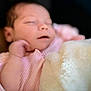 Nova is registered to the contest to win money with this photo: baby, blanket, child, closeup, cozy, cute, face, hand, indoors, infant, newborn, peaceful, pink_clothing, portrait, rest, skin, sleeping, soft_focus, toddler, warm