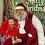 baby, beard, celebration, chair, child, christmas, costume, decoration, festive, glasses, gloves, happy, holiday, indoor, laughing, portrait, red_dress, santa_claus, smile, white_shirt