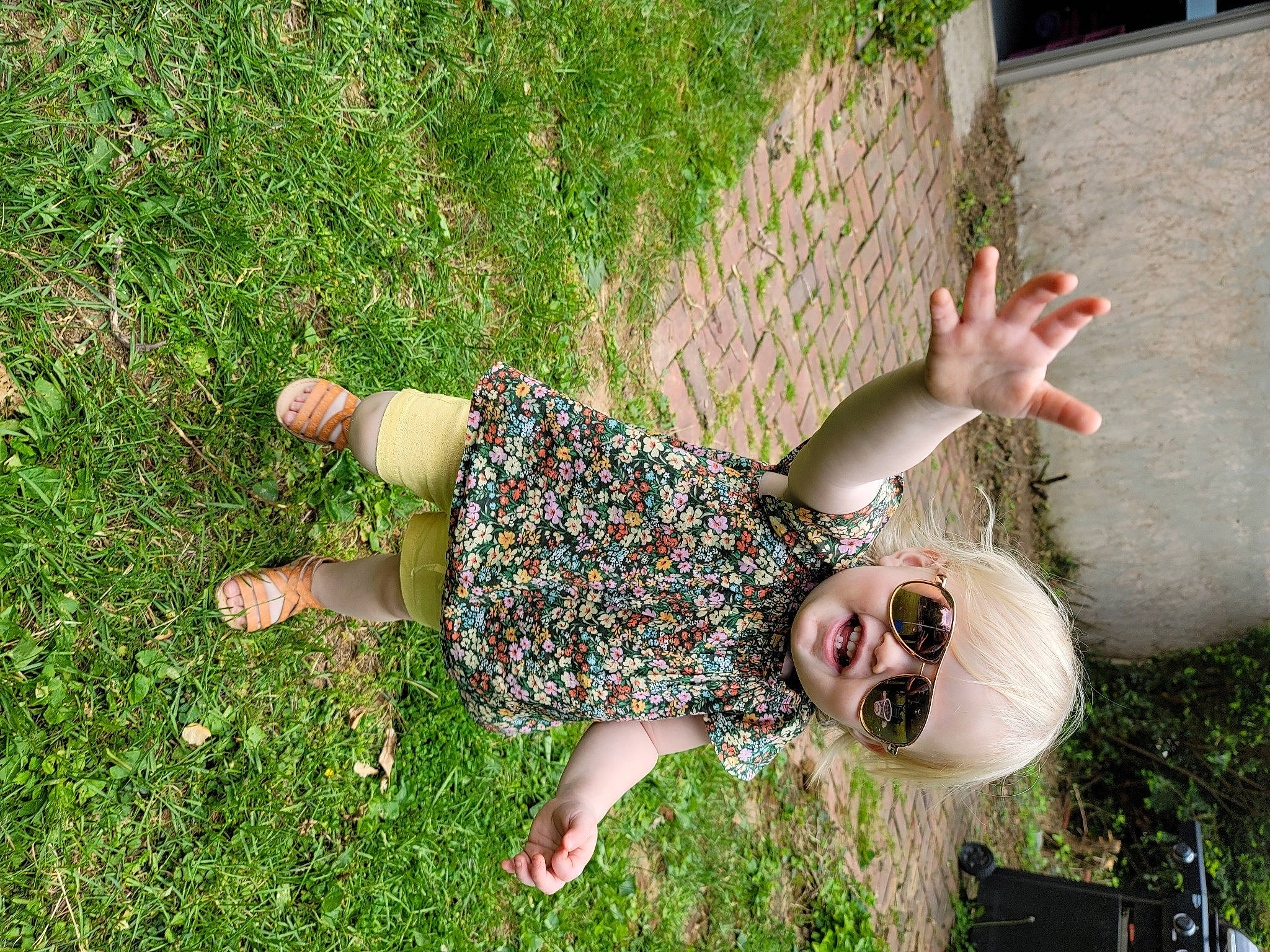 Kynslee joined the competition — help win amazing prizes! barefoot, child, eyewear, fun, grass, grass_family, grassland, groundcover, happy, human_leg, lawn, leisure, pattern, people_in_nature, person, plant, smile, spring, summer, sunglasses