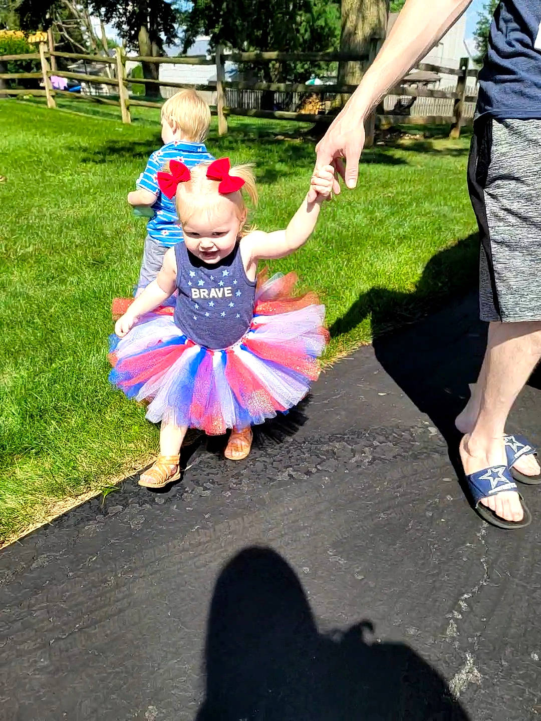 Kynslee is registered to the contest to win money with this photo: asphalt, child, costume, dress, electric_blue, event, footwear, fun, grass, happy, leisure, magenta, people_in_nature, person, plant, recreation, shoe, shorts, sneakers, toddler