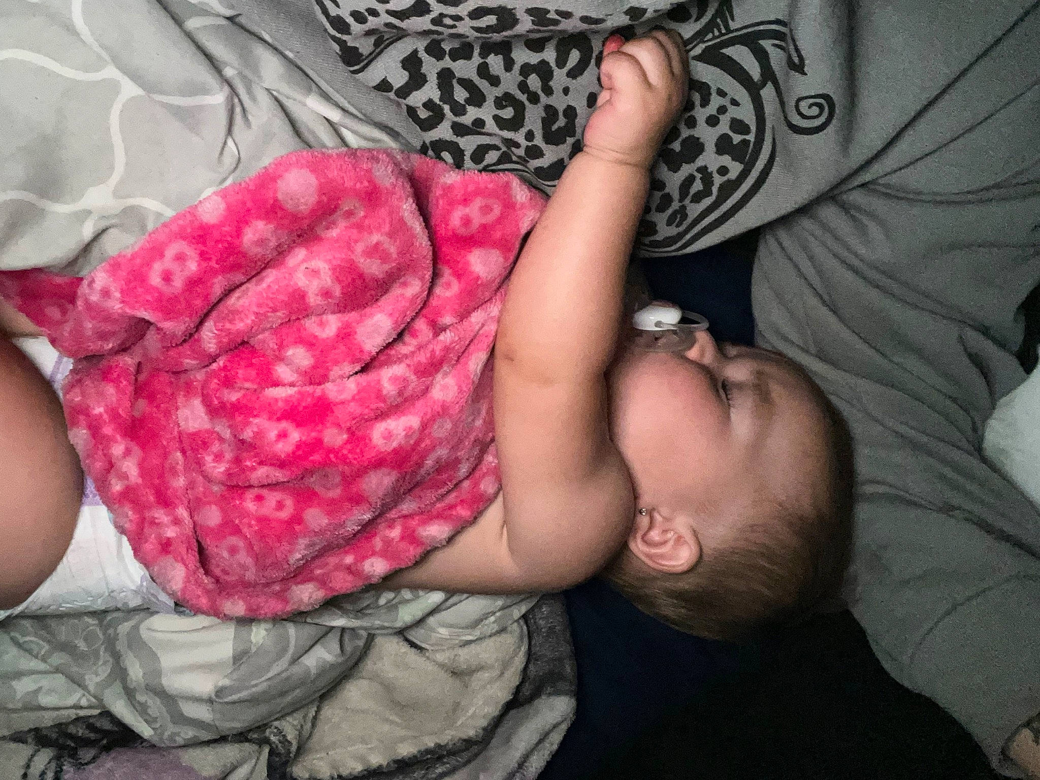 Harper is registered to the contest to win money with this photo: baby, baby_toddler_clothing, child, comfort, finger, gesture, hand, human_leg, interaction, leg, magenta, mouth, nail, pattern, person, pink, skin, thigh, thumb, toddler
