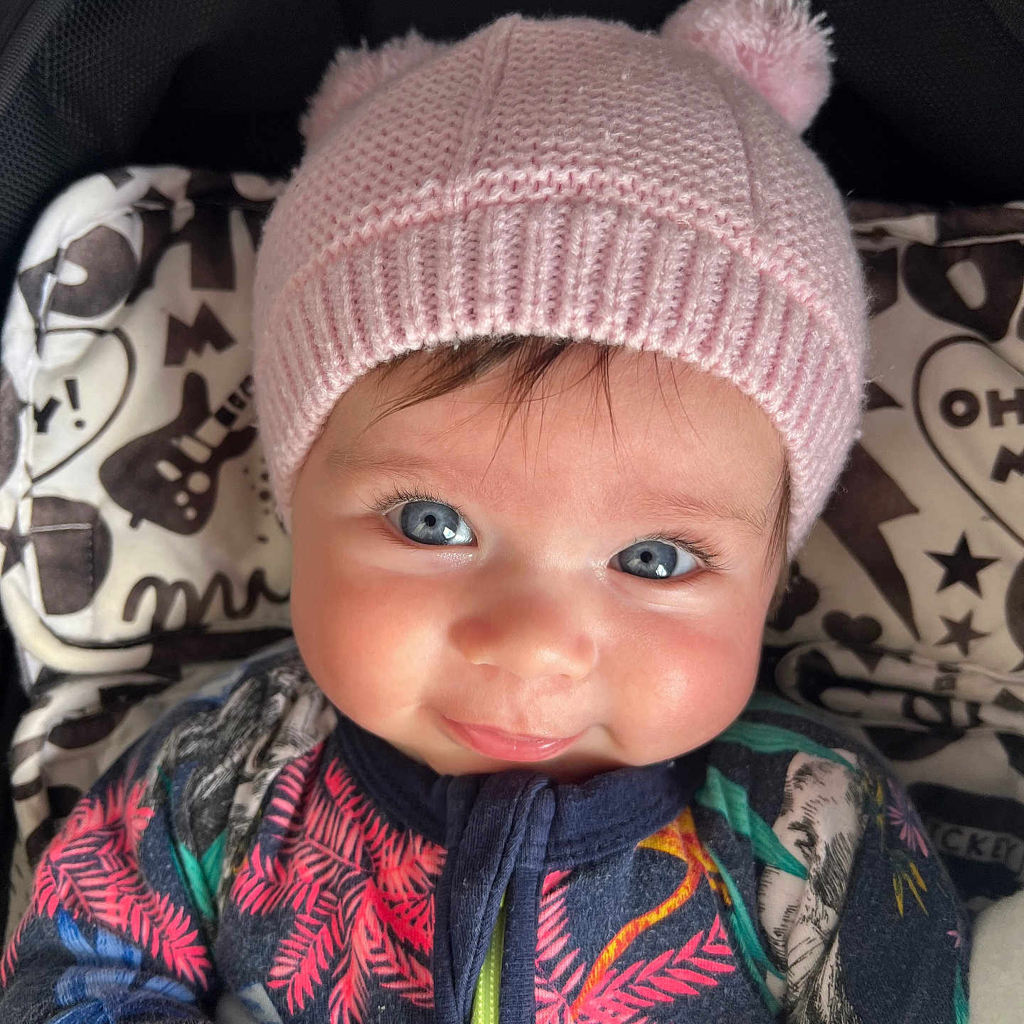 Ruby is registered to the contest to win money with this photo: baby, beanie, bonnet, cap, clothing, coat, face, happy, hat, head, hood, hoodie, jacket, knitwear, person, photography, portrait, scarf, sweater, sweatshirt