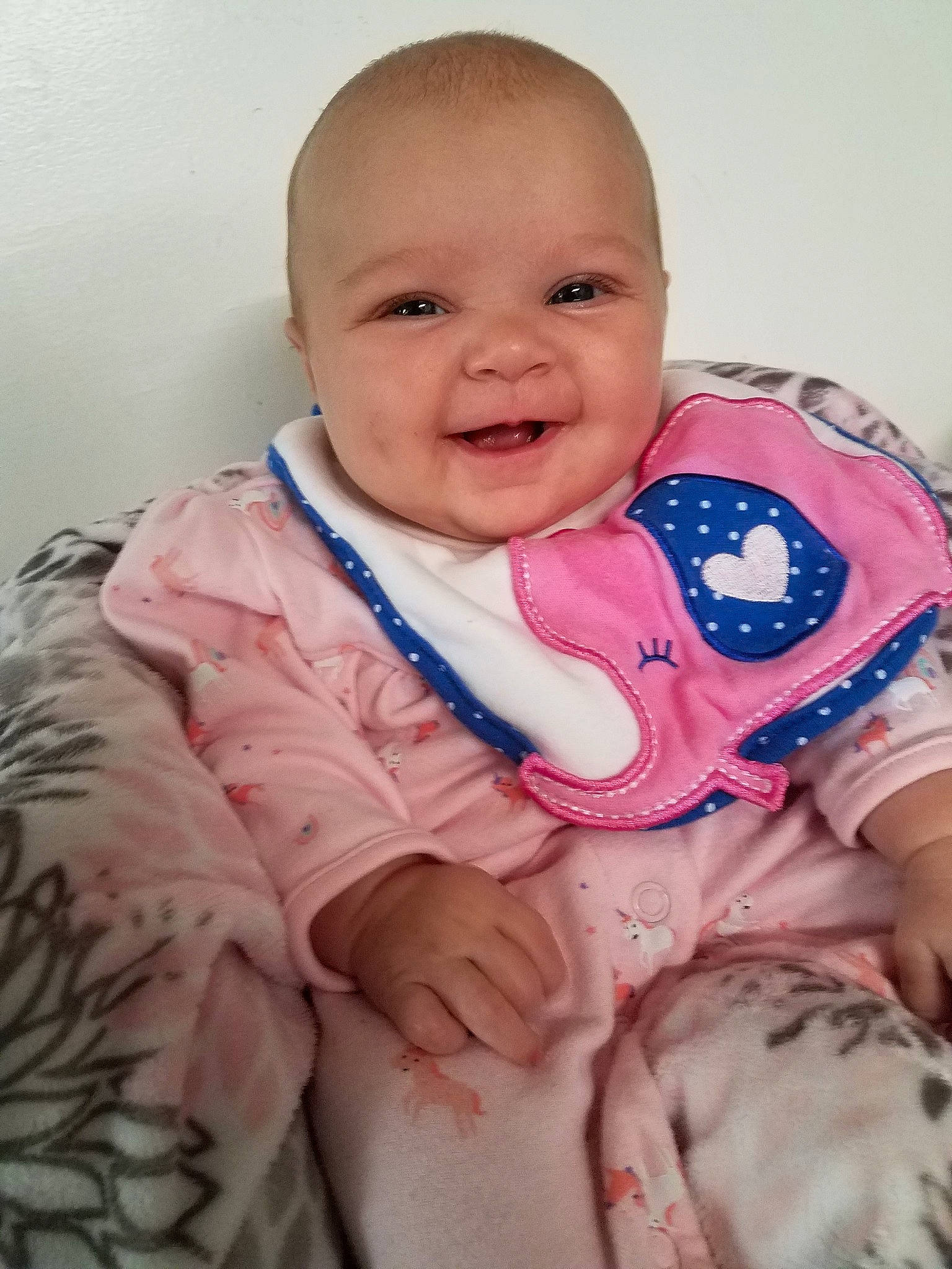 Kamryn is registered to the contest to win money with this photo: baby, baby_making_funny_faces, baby_toddler_clothing, cheek, child, eye, face, facial_expression, forehead, happy, head, iris, joy, lip, mouth, nose, person, pink, sitting, skin